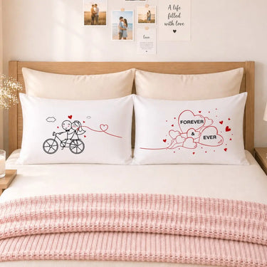 White couple pillowcases with bicycle-and-heart line art and FOREVER EVER text