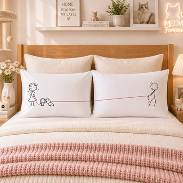 White couple pillowcases with line-art dog and cat characters, red heart-style dividing line