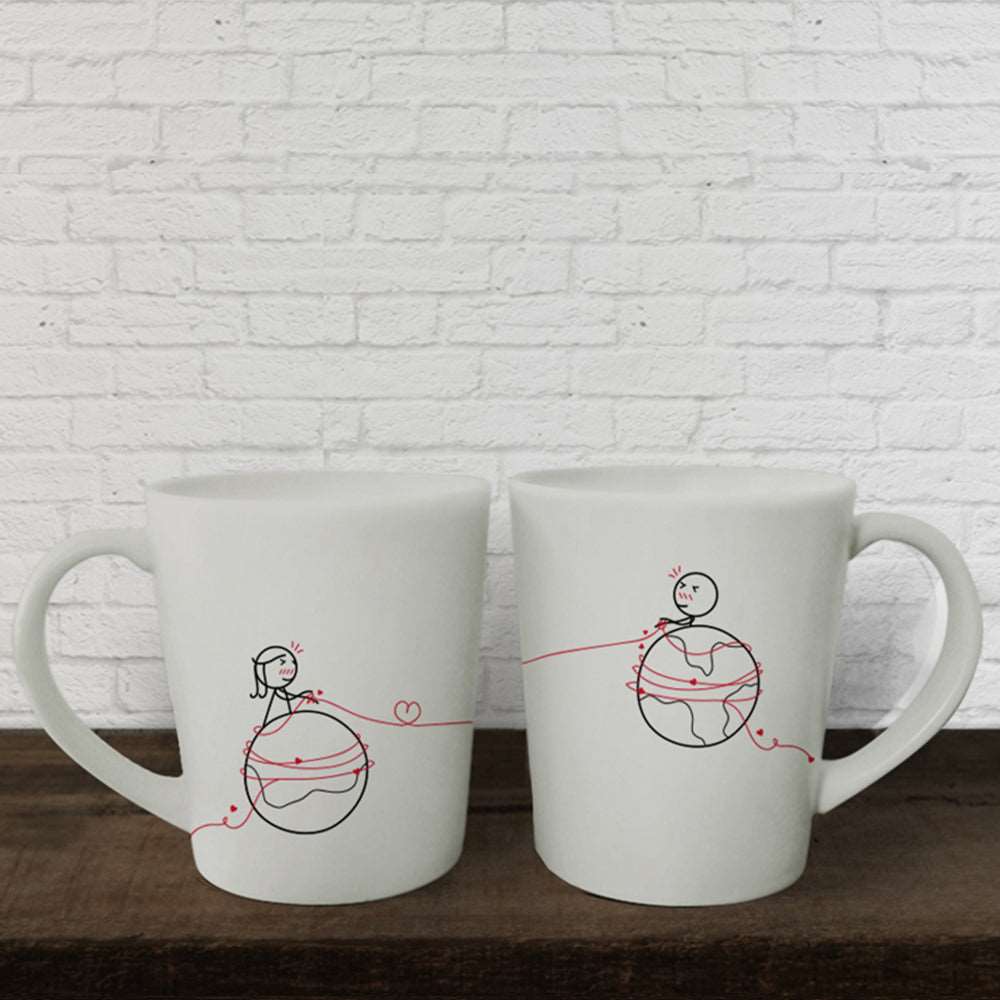 Delightful white mugs adorned with hand-drawn illustrations of a charming man and woman; the perfect gift for couples, anniversaries, or your loved ones!