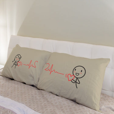 His and hers pillowcases featuring heartbeat designs, perfect for anniversary keepsake gifts