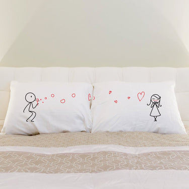 His and hers pillowcases from Human Touch featuring charming couple illustrations, perfect anniversary keepsake gifts.