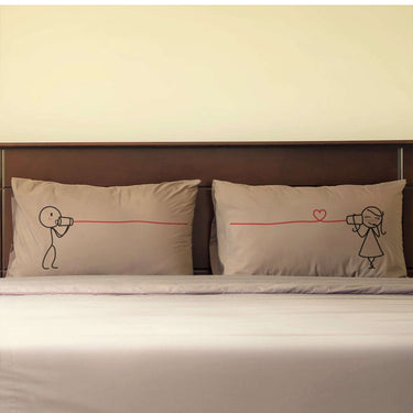 Cute couple pillowcases featuring playful illustrations of a couple sharing love across a line