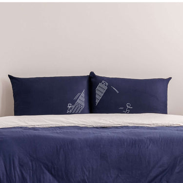 Cute couple pillowcases Pisa tower featuring playful stick figure designs on dark blue fabric