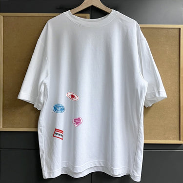 Cute street tee 100 percent cotton in white with colorful graphic patches for casual wear