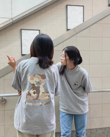 Two models wearing cute teddy bear shirt T-shirt 100 percent recycled in a casual street fashion setting