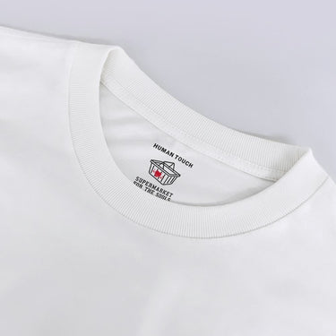 Human Touch apple graphic tee in white featuring a stylish neckline and unique logo design
