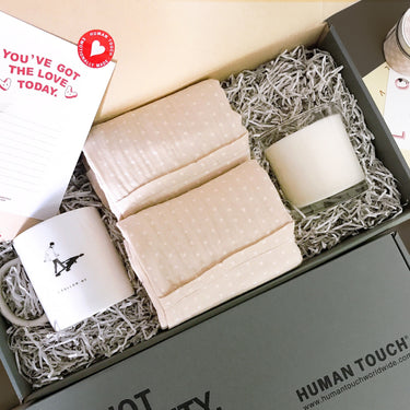 Love-inspired gift set featuring his and hers pillowcases and a candle by Human Touch