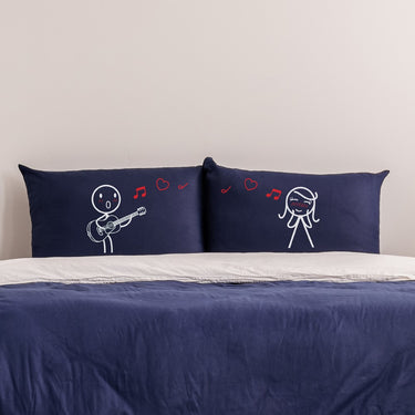 His and hers pillowcases featuring playful cartoon designs, perfect for romantic bedroom decor