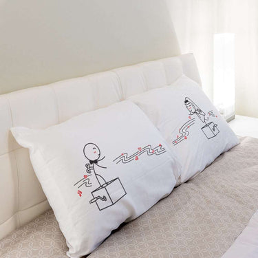 His and hers pillowcases featuring playful dancing hearts, perfect unique anniversary gifts