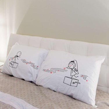 His and hers pillowcases featuring playful dancing hearts, perfect as unique anniversary gifts