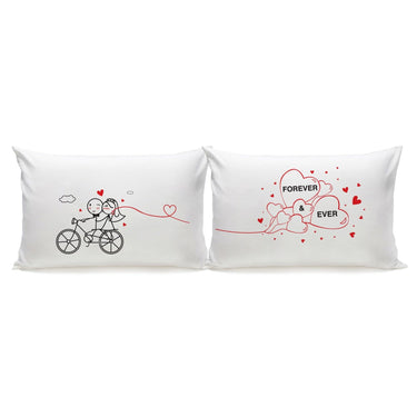 His and hers pillowcases featuring a couple on a bicycle and hearts, unique wedding keepsakes for celebrating love.