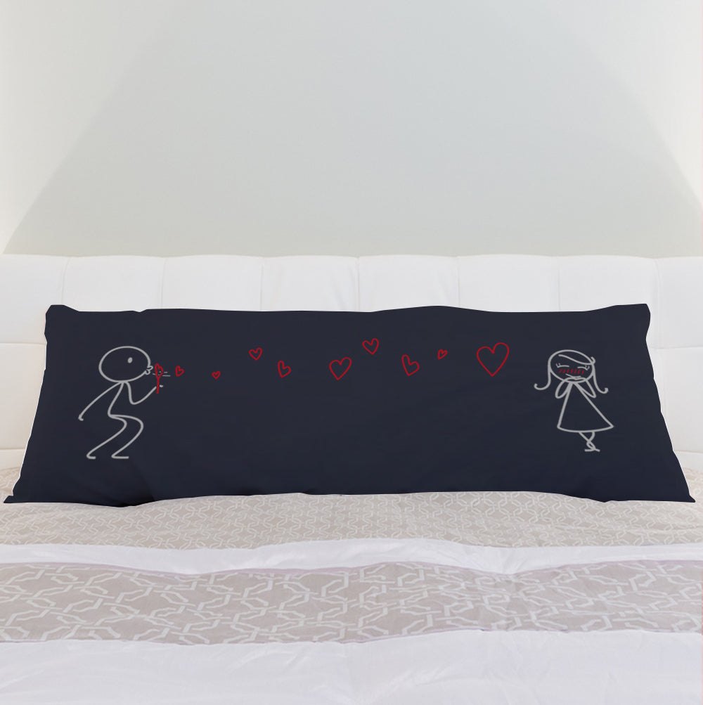 a black bed with a black and red pillow 