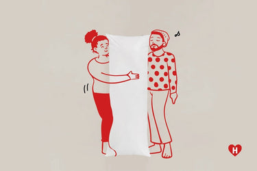 White long pillow with two red line-art characters standing
