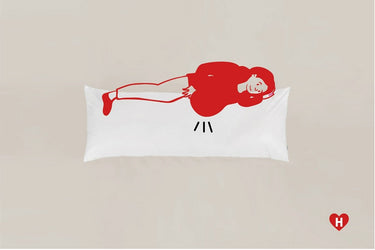 White long pillow with a red line-art character lying down