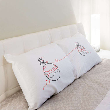 His and hers pillowcases featuring a romantic design, a perfect long distance relationship gift