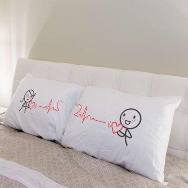 His and hers pillowcases with cute heartbeat designs, perfect matching gifts for lovers