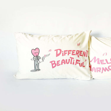 His and hers organic cotton romantic couple pillow set featuring playful designs and heartwarming messages