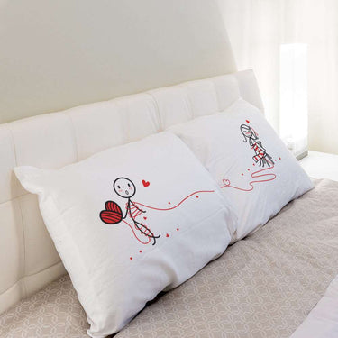 His and hers pillowcases with cute couple illustrations, perfect personalized anniversary gifts