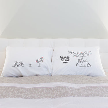 His and hers pillowcases featuring love-themed designs, perfect as a romantic anniversary gift set