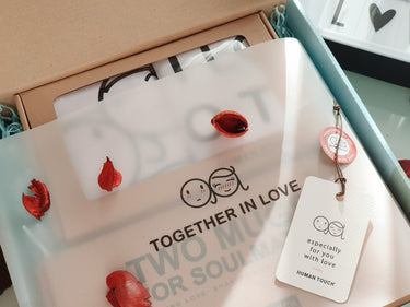 Human Touch romantic gift box featuring love-themed items for a personalized gift experience