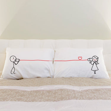 His and hers pillowcases featuring playful characters, a perfect romantic gift set for couples