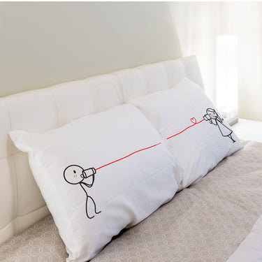 His and hers pillowcases featuring cute stick figures, a perfect romantic gift set for couples
