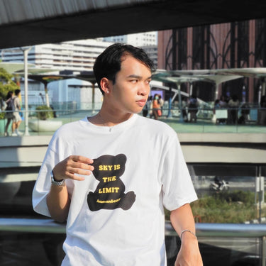 Casual street fashion model wearing a white tee with bear graphic promoting self love couple matching tee