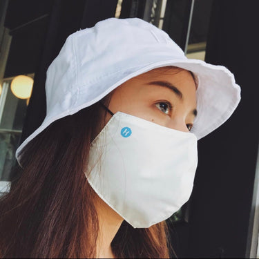 Human Touch stylish mask paired with a bucket hat as a self-love fashion accessory