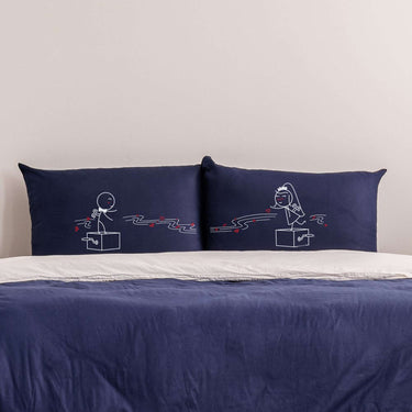 His and hers pillowcases from Human Touch featuring playful designs for unique anniversary gifts