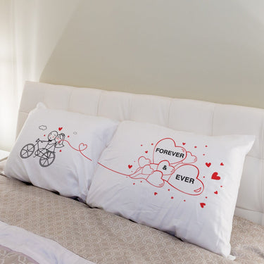 His and hers pillowcases featuring romantic illustrations, perfect as unique wedding gifts