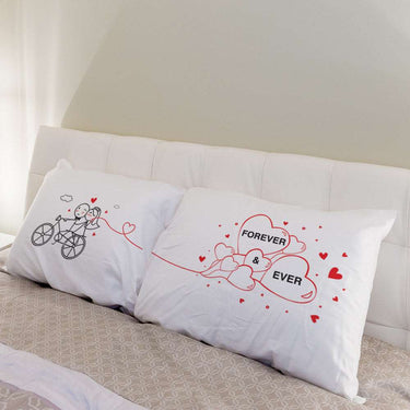His and hers pillowcases featuring unique wedding keepsakes with heart designs and couple illustrations
