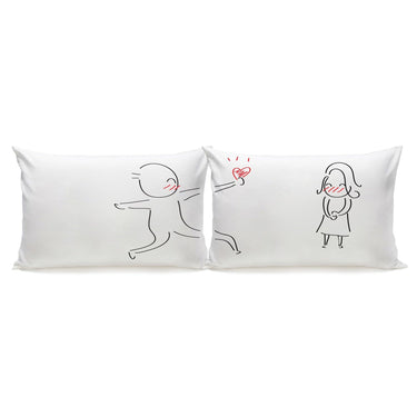 His and hers pillowcases by Human Touch featuring playful love-themed designs, perfect wedding keepsakes decor