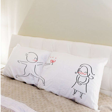 His and hers pillowcases featuring cute illustrations, perfect wedding keepsakes decor for couples
