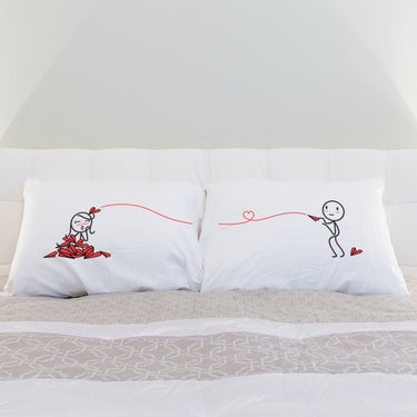 His and hers pillowcases featuring playful designs, perfect for couple gift ideas for romantic evenings