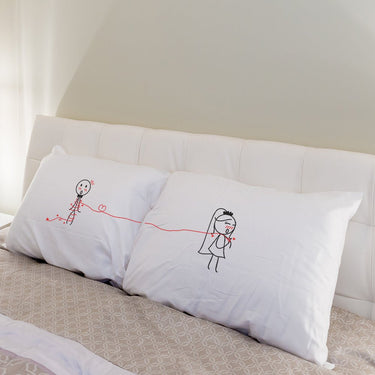 His and hers pillowcases with cute illustrations, perfect custom wedding keepsakes for couples