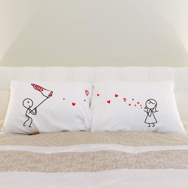 His and hers pillowcases featuring cute illustrations, a cute cushion for lovers for a romantic bedroom decor