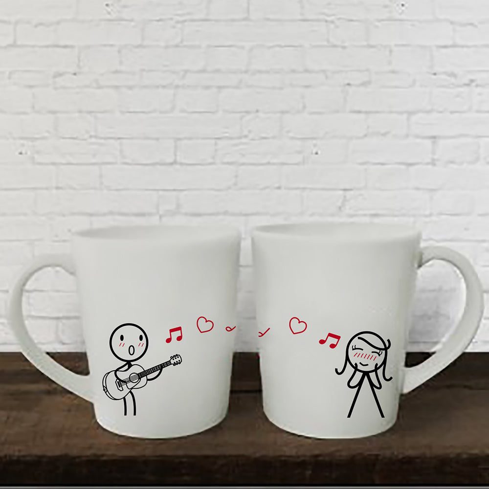 Adorned with charming drawings, these two white mugs make a perfect gift for couples, anniversaries, or for him and her.