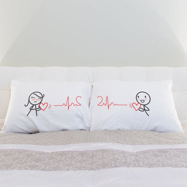 His and hers pillowcases with heart and heartbeat designs, perfect matching gifts for lovers.
