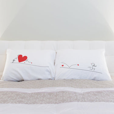 Unique wedding gifts for couples featuring his and hers pillowcases with romantic illustrations and heart designs