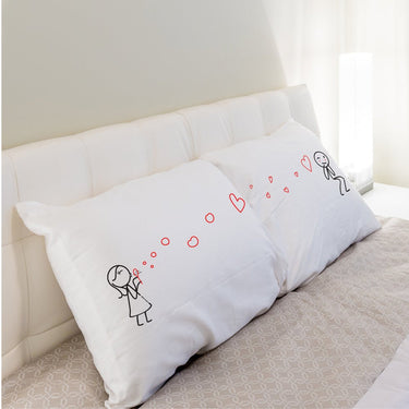 His and hers pillowcases featuring cute illustrations, perfect personalized anniversary keepsakes.