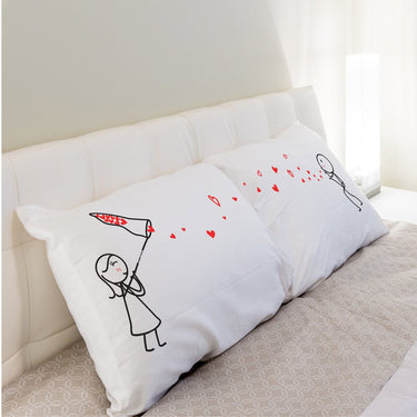 His and hers pillowcases featuring cute drawings, ideal romantic couple gifts for special occasions
