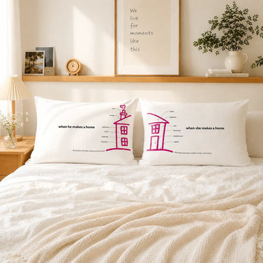 Pair of white couple pillowcases with pink house and matching text designs