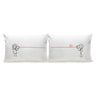 White couple pillowcases with red dialogue line and small heart between cartoon figures