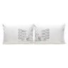 Two white pillowcases side by side featuring couple message illustration and icons