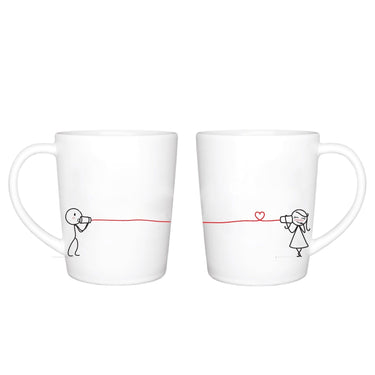 Couples coffee mugs featuring cute characters connecting with a heart, perfect anniversary keepsakes for him and her.