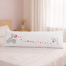 Human Touch long distance relationship gift pillow featuring romantic design of hearts and a cyclist for couples