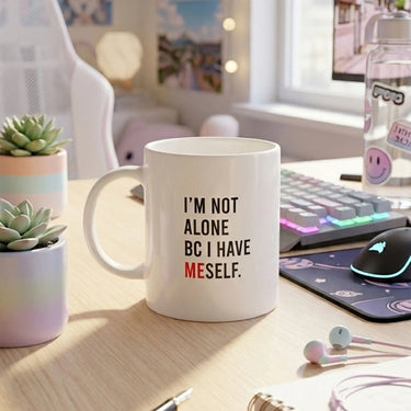 Ceramic coffee mug with motivational quote 'I'm not alone bc I have myself', perfect for selflove motivation and cozy moments