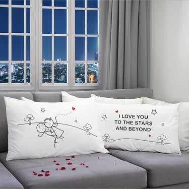 Pair of white couple pillowcases with space-themed cartoon and "I love you" text