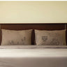 Sand beige couple pillowcases with love quote and stick-figure couple and tree designs