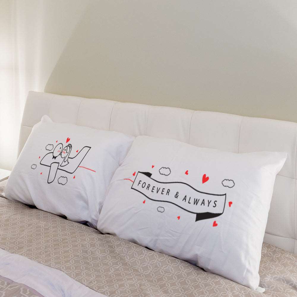 A beautifully adorned white pillow sitting elegantly on a cozy bed, perfect for couples seeking creative gifts to celebrate their love.
